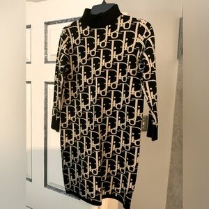 Sweater dress with mock neck band. 3/4 inch sleeves Size M.